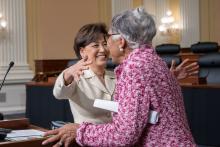 Reps. Beatty and Kim embrace at the Financial Literacy Resource Fair